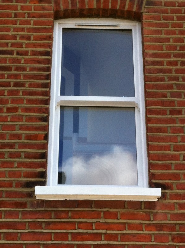 uPVC sash window on Victorian red brick house in Carshalton